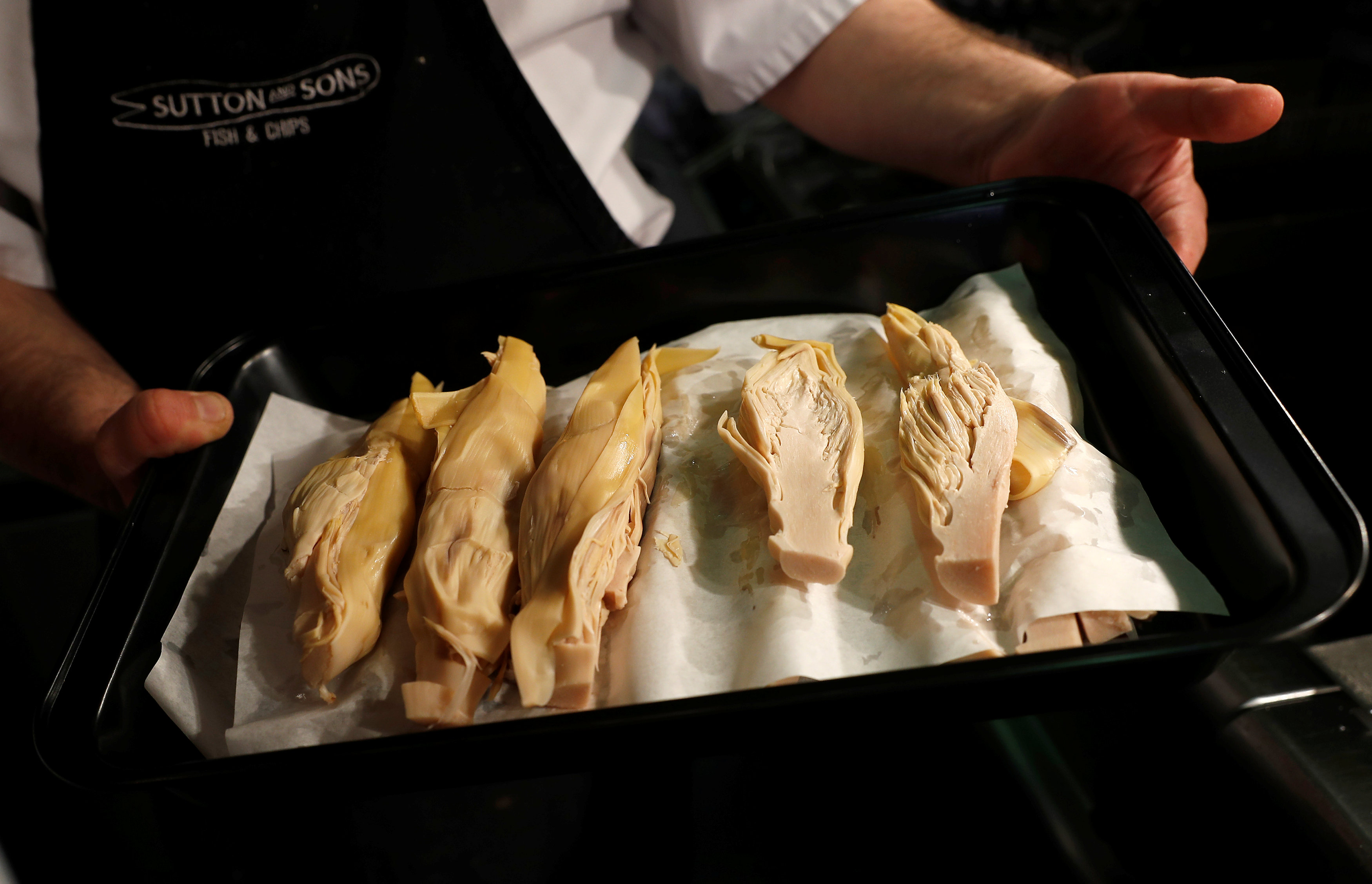 Portions of Banana Blossom are prepared before cooking, in Sutton and Sons vegan fish and chip restaurant in Hackney, London